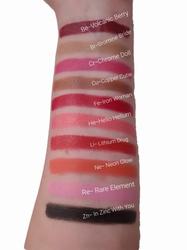 A close up of the lipstick colors on someones arm