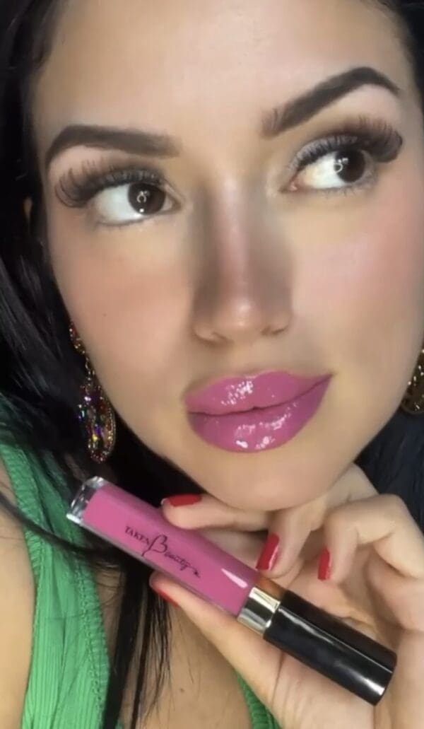 A woman with pink lipstick on her lips.