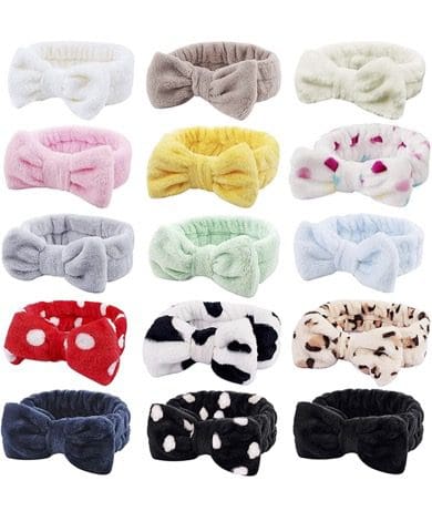 A bunch of different colored hair ties with bows
