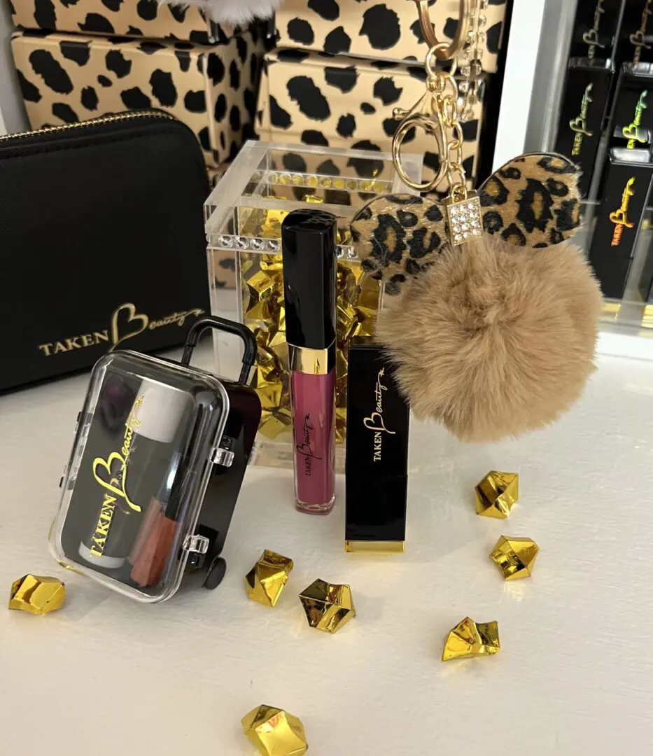 A table with some makeup products and a leopard print bag