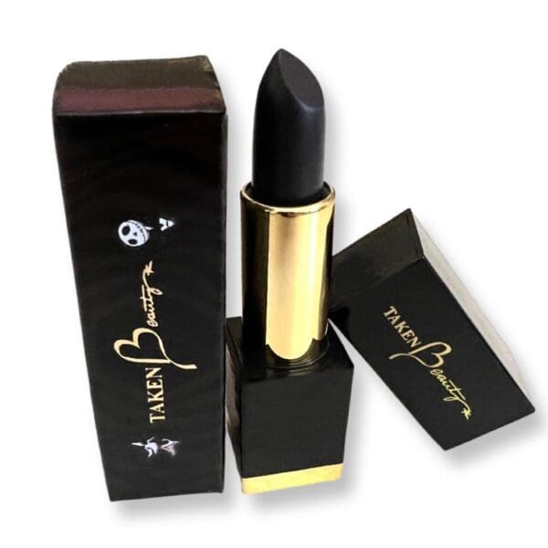 A black lipstick in a box with gold label.