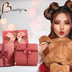 A woman holding a teddy bear and some presents