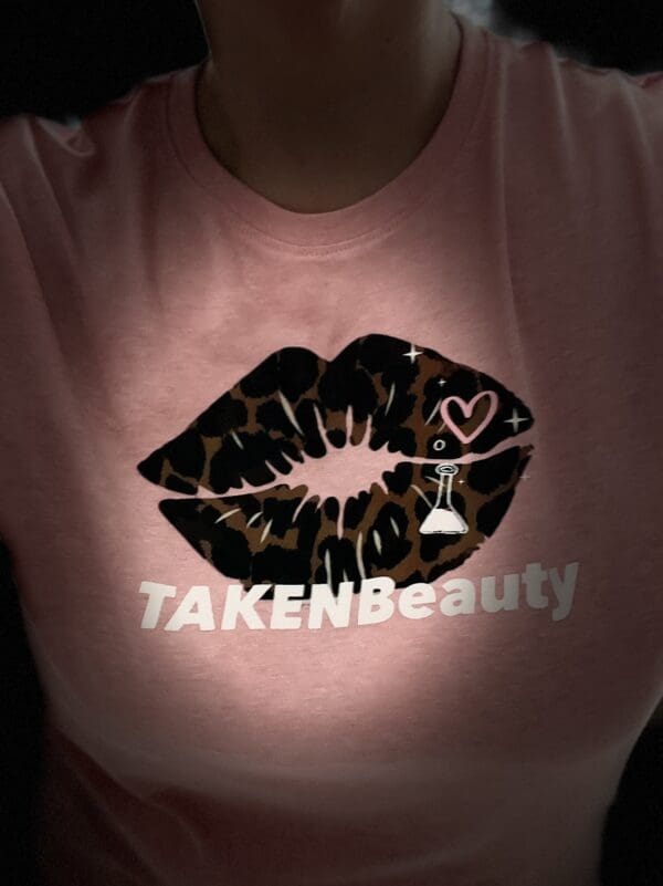A close up of the front of a shirt with a leopard print lip.