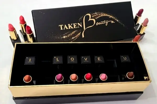 A box of lipstick with the words " i love you ".