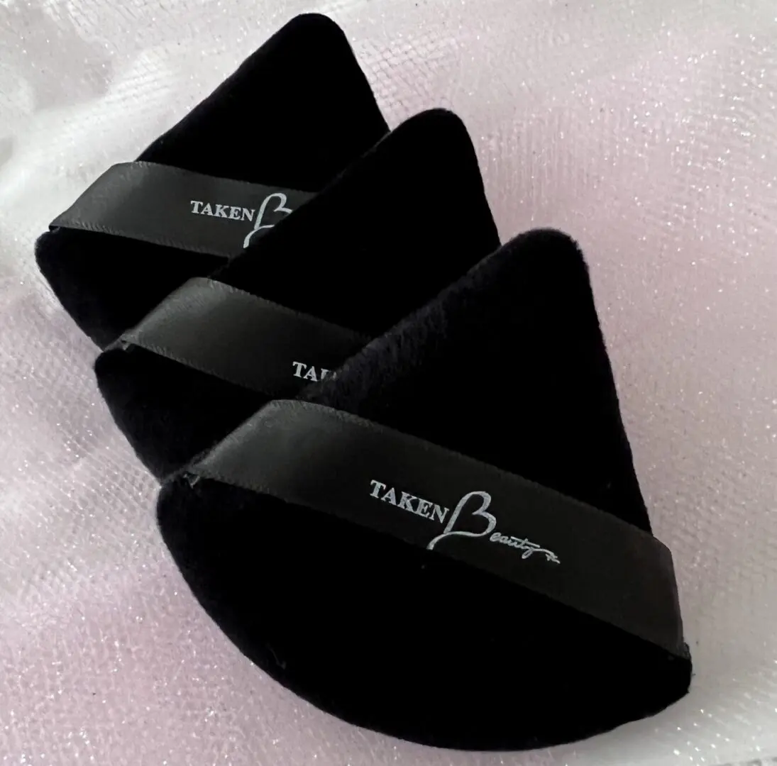 Three black wedges with a white logo on top of them.