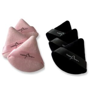 A pair of pink and black triangle shaped pillows.
