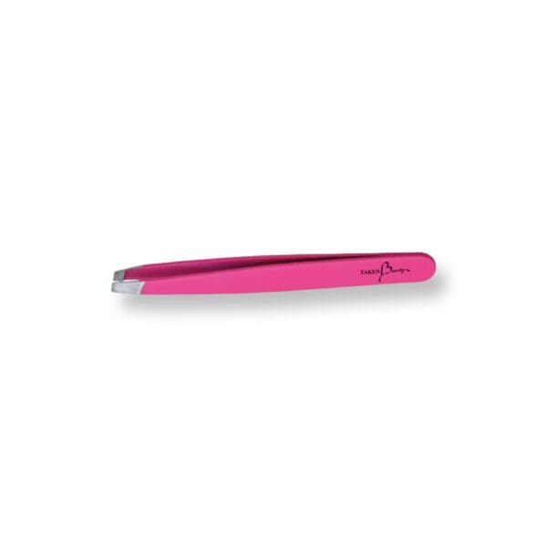 A pink tweezer is laying on its side.