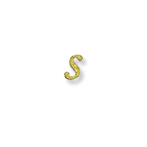 A gold letter s is sitting on top of the table.