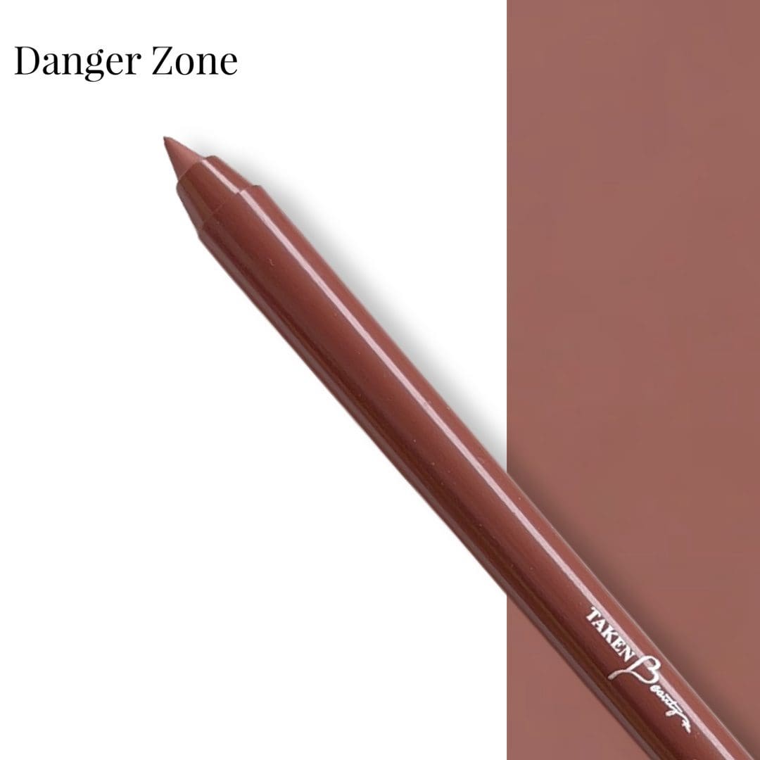 A brown pencil with a red tip and the words danger zone