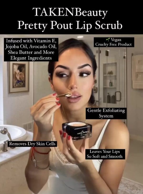 A woman is putting some lip scrub on her lips