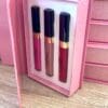 A set of three lipsticks in a box.
