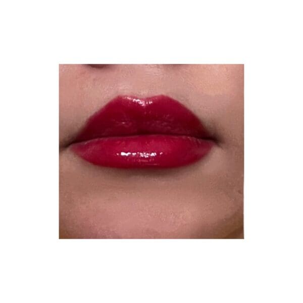 A close up of the lips with red lipstick
